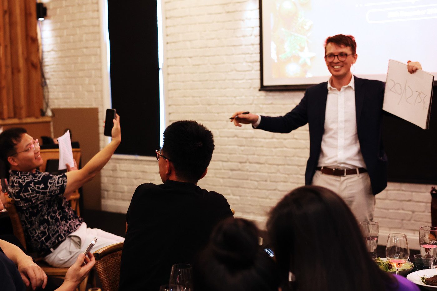 Sam performing at a corporate dinner